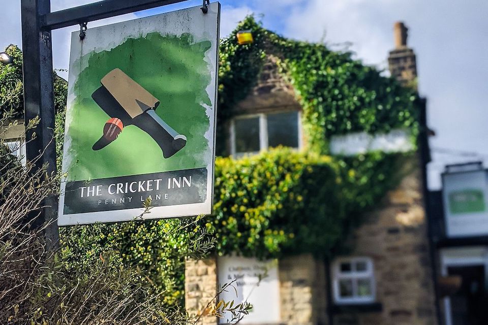 The Cricket Inn signage