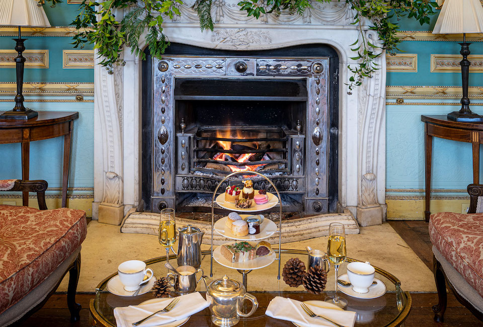Festive Afternoon Tea at Swinton Estate next to fireplace