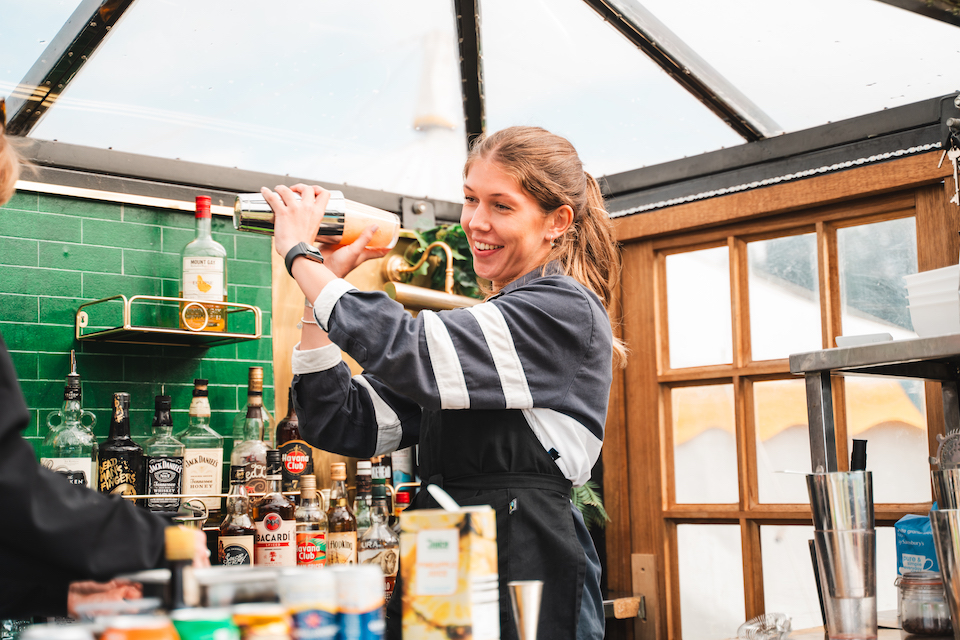 Woman shaking a cocktail at the food festival in Harrogate