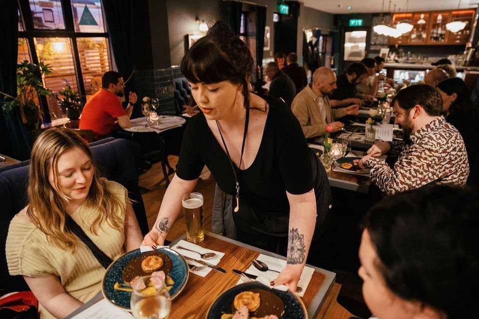 Whitelocks Leeds staff serving customers at dinner club